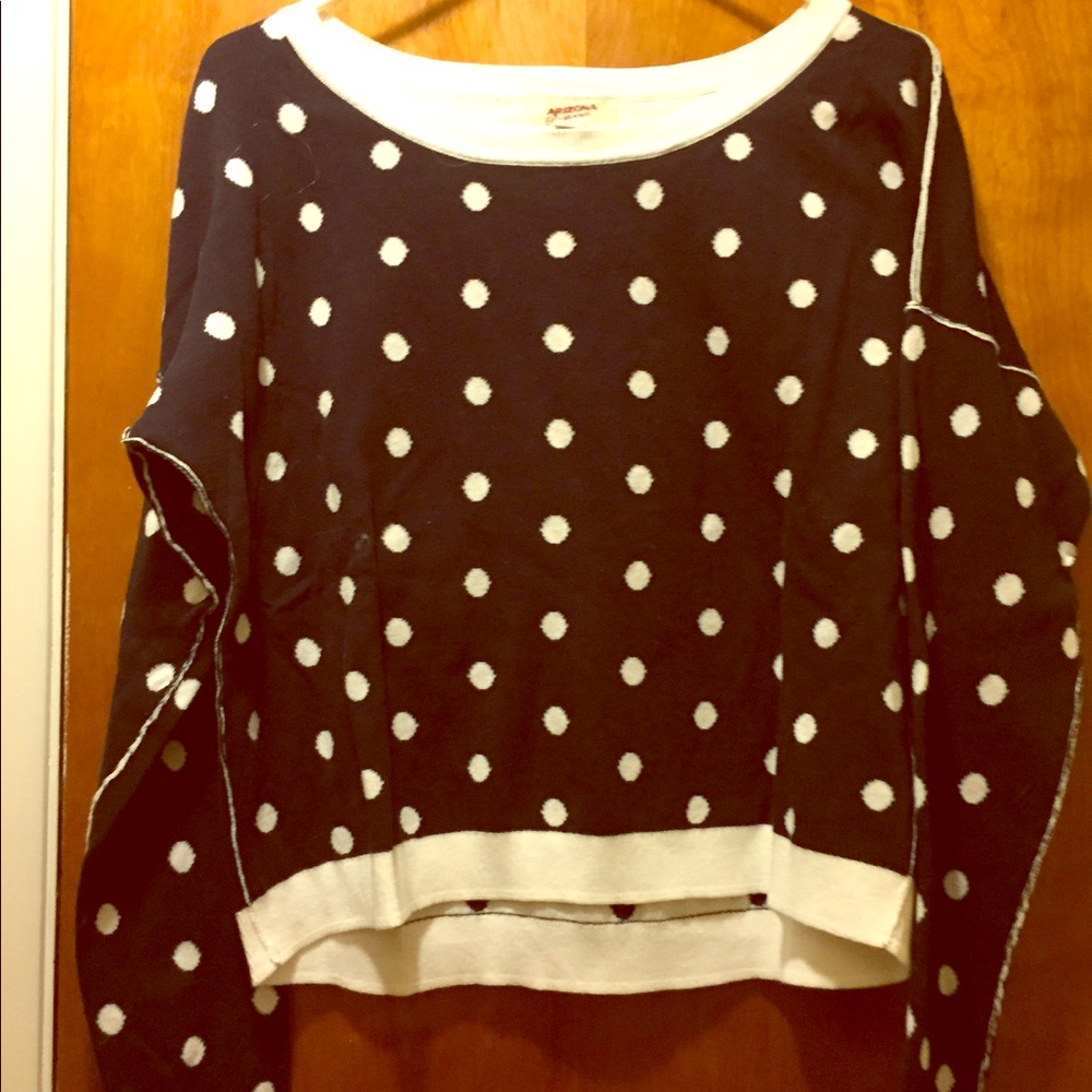 Navy sweater with white polka dots.